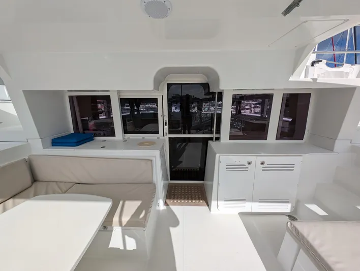 Southern Charm Yacht Photos Pics Interior view of 2015 Lagoon 450 F catamaran with seating and storage.