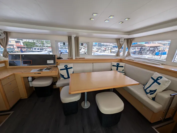 Southern Charm Yacht Photos Pics Interior of 2015 Lagoon 450 F catamaran with cozy seating and nautical decor.