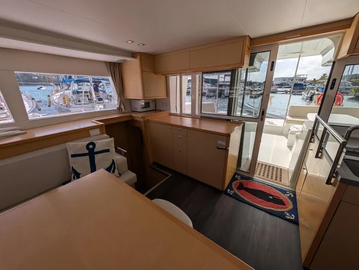 Southern Charm Yacht Photos Pics Interior of 2015 Lagoon 450 F yacht with modern furnishings and marina view.