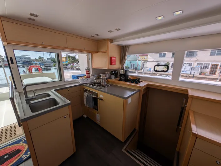 Southern Charm Yacht Photos Pics Modern kitchen interior of 2015 Lagoon 450 F catamaran with ample natural light.