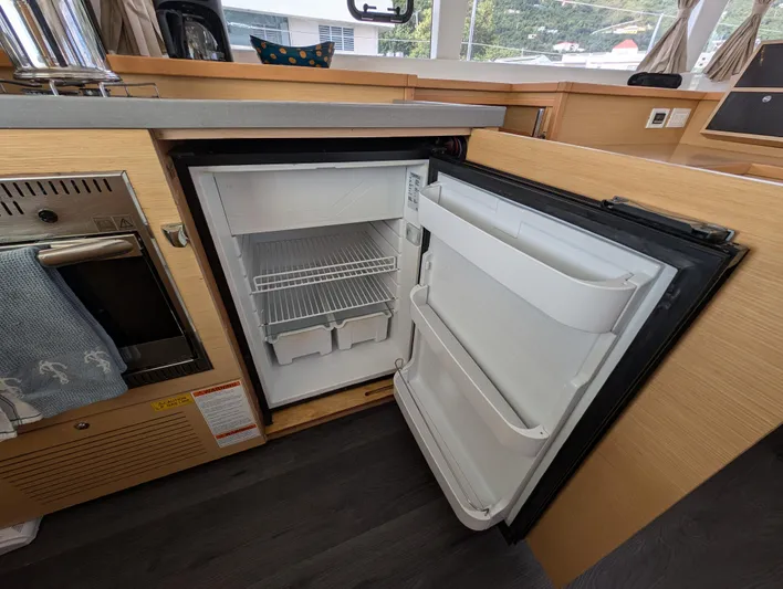 Southern Charm Yacht Photos Pics Open refrigerator in 2015 Lagoon 450 F yacht kitchen interior.
