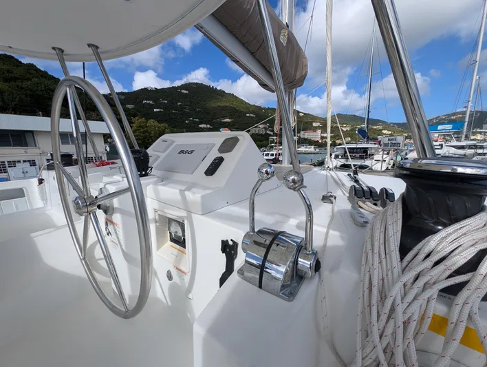 Southern Charm Yacht Photos Pics Helm of 2015 Lagoon 450 F catamaran with steering wheel and control panel.