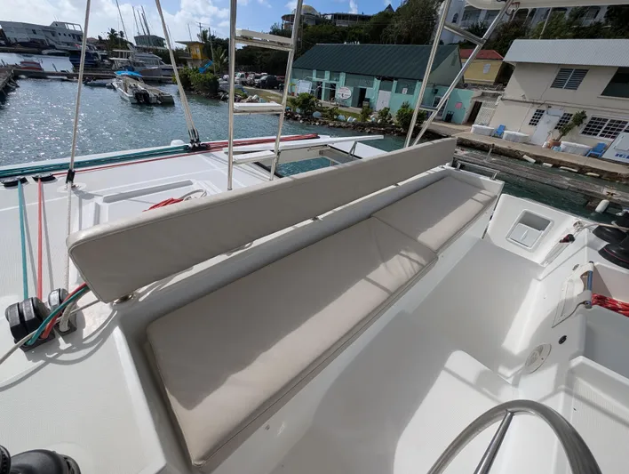 Southern Charm Yacht Photos Pics Lagoon 450 F catamaran deck with seating, docked at marina, 2015 model.