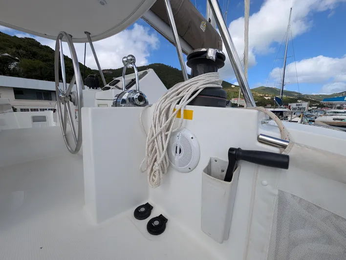 Southern Charm Yacht Photos Pics Helm station of 2015 Lagoon 450 F catamaran with steering wheel and ropes.