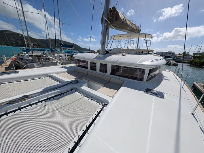 Southern Charm Yacht Photos Pics 2015 Lagoon 450 F catamaran docked in a sunny marina.
