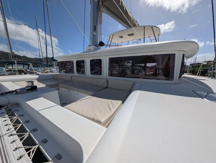 Southern Charm Yacht Photos Pics 2015 Lagoon 450 F catamaran with spacious deck and seating under a clear sky.
