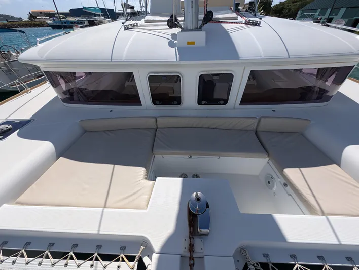 Southern Charm Yacht Photos Pics 2015 Lagoon 450 F catamaran deck with cushioned seating and windows.