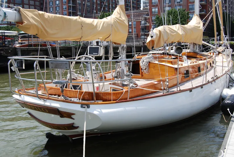 Sappho Yacht Photos Pics 1983 Cherubini 44 Ketch sailboat docked in a marina.