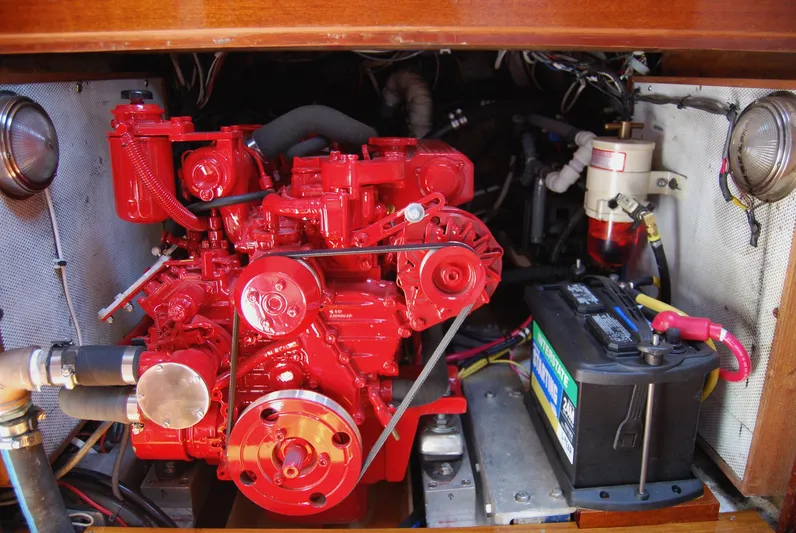 Sappho Yacht Photos Pics Red engine and battery compartment of a 1983 Cherubini 44 Ketch sailboat.