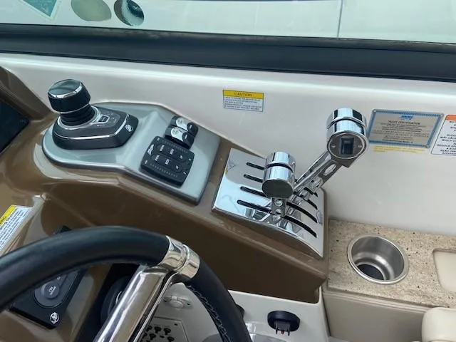  Yacht Photos Pics Control panel of a 2017 Formula 350 Sun Sport boat with throttle and joystick.