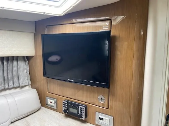  Yacht Photos Pics 2017 Formula 350 Sun Sport interior with mounted TV and control panel.