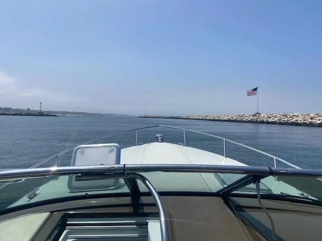  Yacht Photos Pics View from a 2017 Formula 350 Sun Sport boat cruising in a harbor with an American flag.