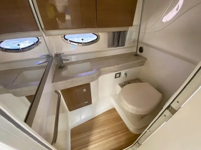  Yacht Photos Pics 2017 Formula 350 Sun Sport bathroom with modern fixtures and wooden cabinetry.