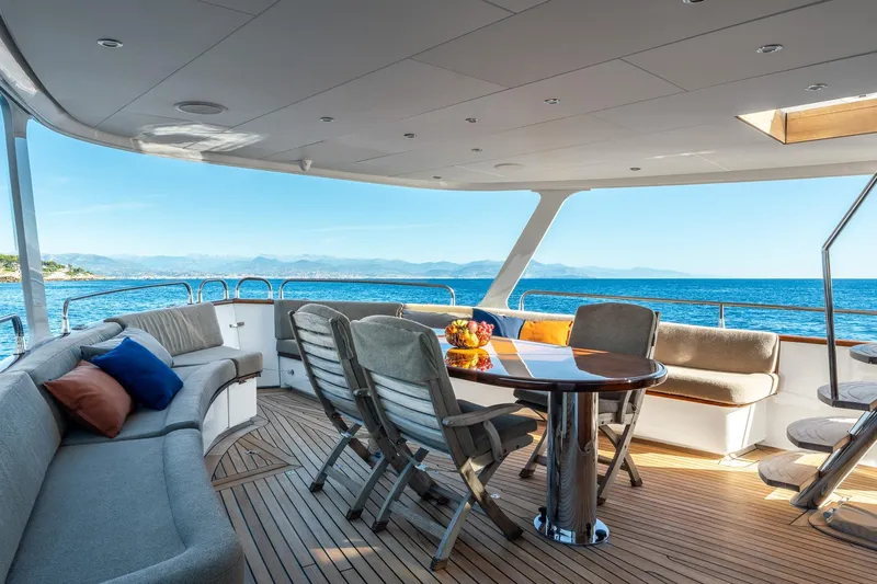 Sultana Yacht Photos Pics Luxurious 1969 Feadship 25.8m yacht deck with elegant seating and ocean view.