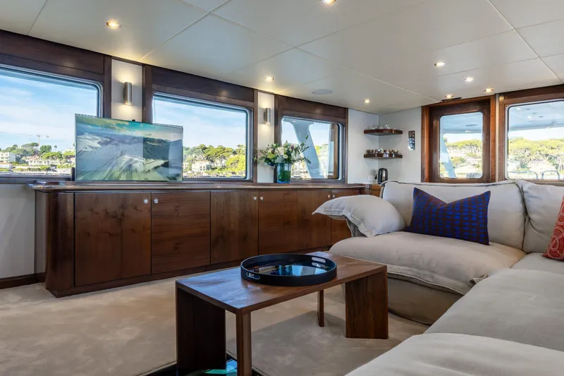 Sultana Yacht Photos Pics Luxurious interior of 1969 Feadship 25.8m yacht with elegant furnishings and scenic views.