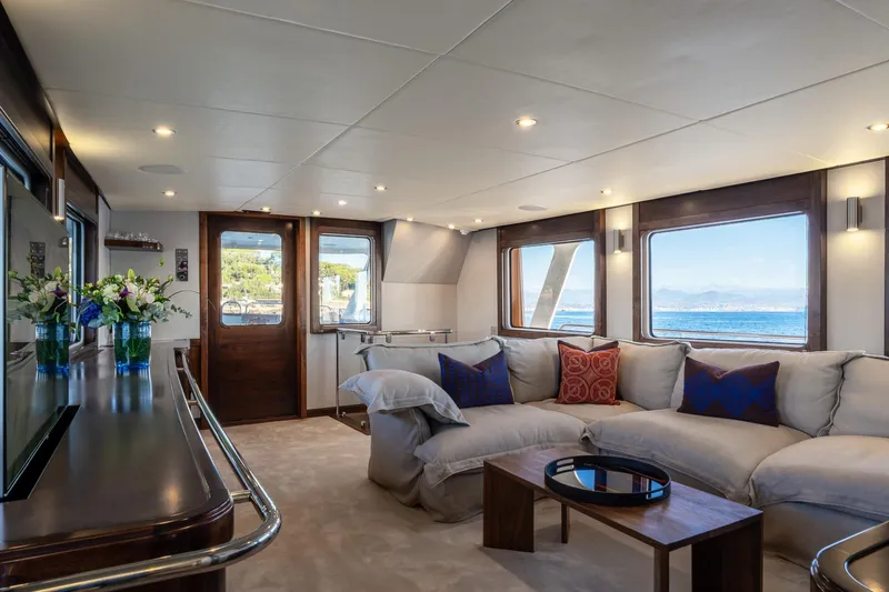 Sultana Yacht Photos Pics Luxurious interior of 1969 Feadship 25.8m yacht with elegant seating and ocean view.