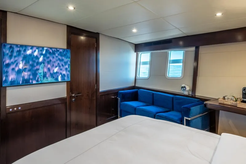 Sultana Yacht Photos Pics Luxurious cabin interior of 1969 Feadship 25.8m yacht with modern amenities and elegant design.