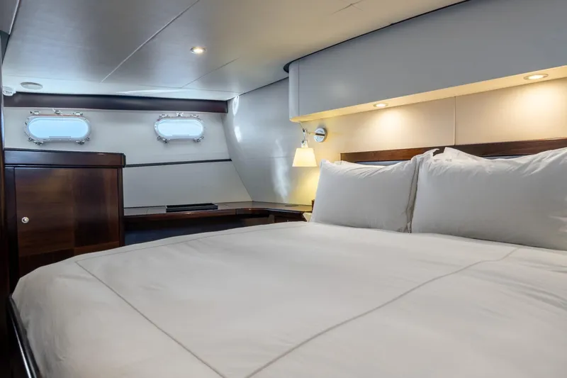 Sultana Yacht Photos Pics Luxurious cabin interior of 1969 Feadship 25.8m yacht with elegant wood accents.