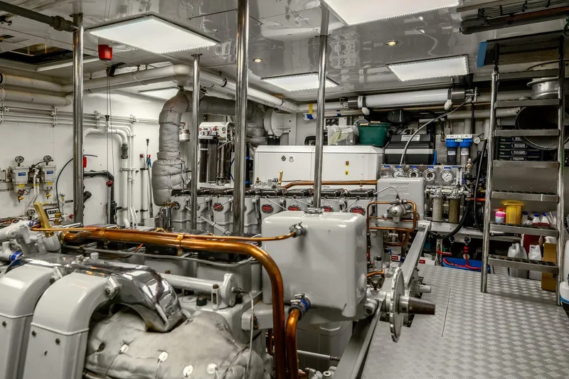 Sultana Yacht Photos Pics Engine room of a 1969 Feadship 25.8m yacht, showcasing machinery and equipment.