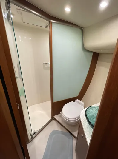 Lion Around Yacht Photos Pics 2006 Tiara Yachts 4300 Sovran bathroom with modern shower and glass sink.
