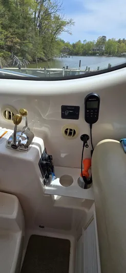 Lion Around Yacht Photos Pics 2006 Tiara Yachts 4300 Sovran helm with controls and scenic waterway view.