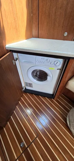 Lion Around Yacht Photos Pics 2006 Tiara Yachts 4300 Sovran interior with built-in washing machine.