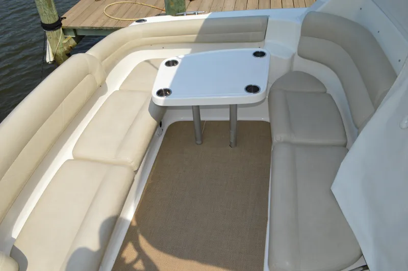 Lion Around Yacht Photos Pics 2006 Tiara Yachts 4300 Sovran seating area with table on deck.