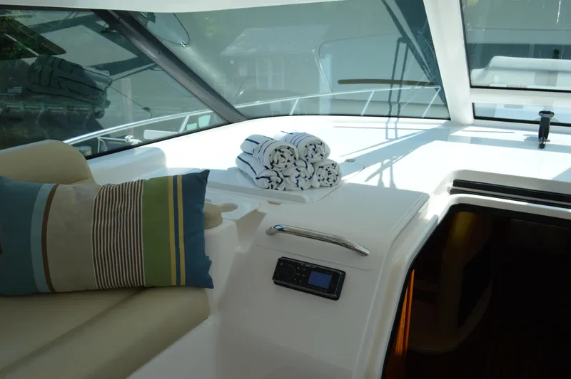 Lion Around Yacht Photos Pics Interior of 2006 Tiara Yachts 4300 Sovran with cushions and rolled towels.