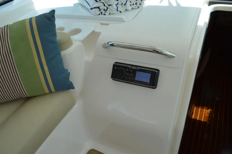 Lion Around Yacht Photos Pics 2006 Tiara Yachts 4300 Sovran interior with control panel and striped cushion.