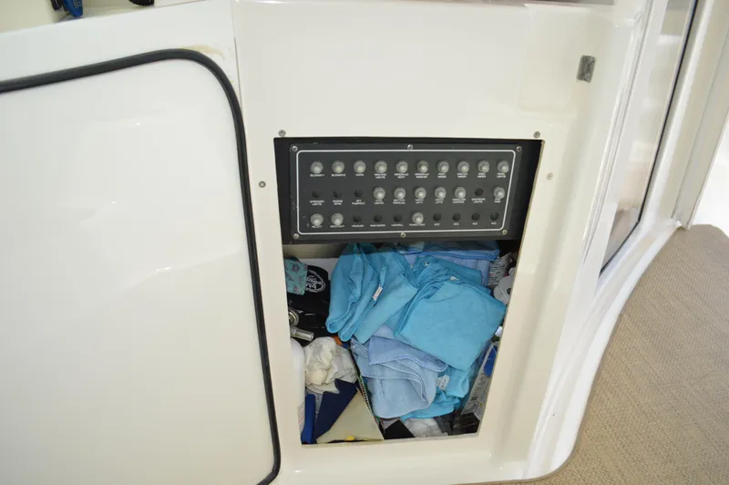Lion Around Yacht Photos Pics Electrical panel and storage compartment on 2006 Tiara Yachts 4300 Sovran.