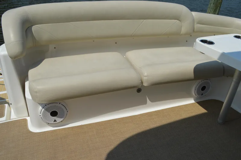 Lion Around Yacht Photos Pics 2006 Tiara Yachts 4300 Sovran seating area with beige cushions and built-in speakers.