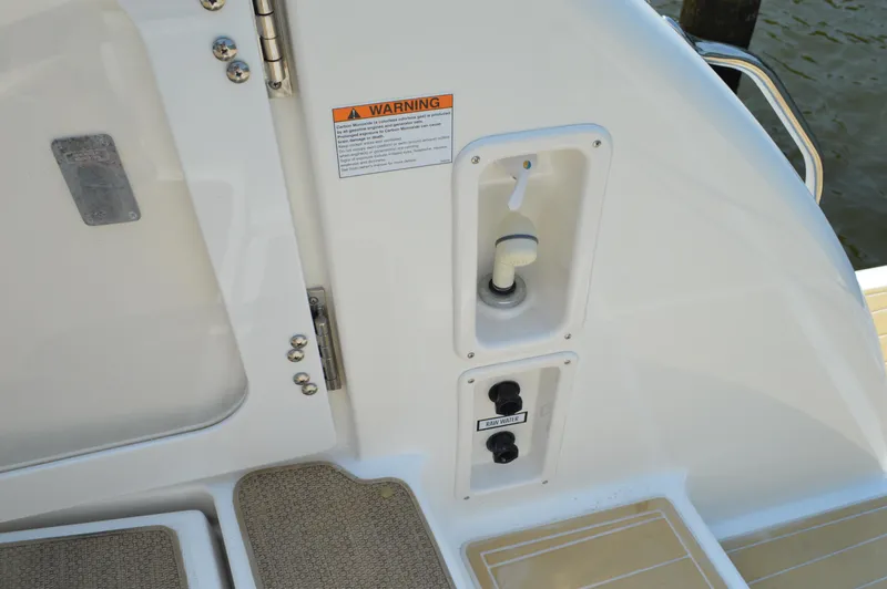 Lion Around Yacht Photos Pics 2006 Tiara Yachts 4300 Sovran deck detail with warning label and controls.