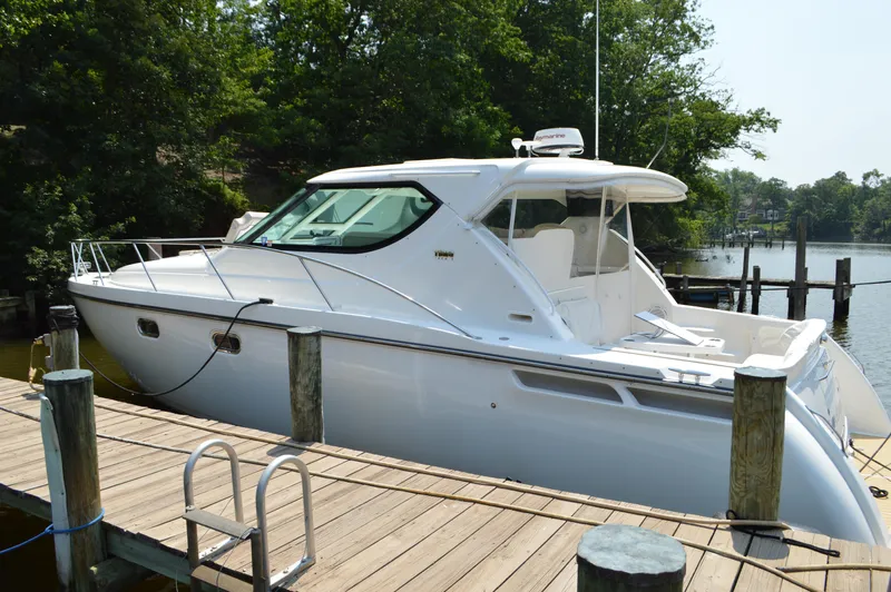 Lion Around Yacht Photos Pics 2006 Tiara Yachts 4300 Sovran docked, showcasing sleek design and luxury features.