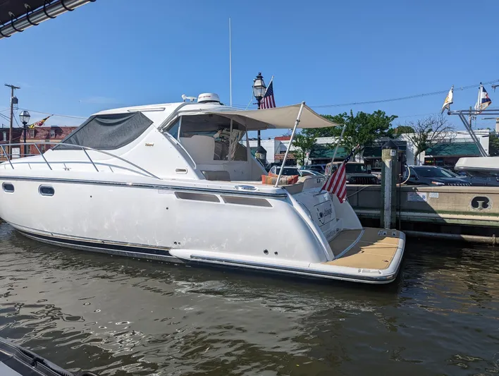 Lion Around Yacht Photos Pics 2006 Tiara Yachts 4300 Sovran docked, featuring sleek design and American flags.