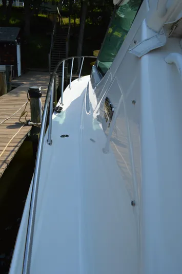 Lion Around Yacht Photos Pics 2006 Tiara Yachts 4300 Sovran docked, showcasing sleek white exterior and railing.