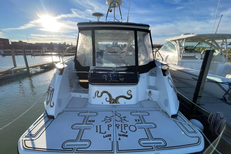  Yacht Photos Pics 2018 Benetau Gran Turismo 40 yacht docked at marina, rear view with custom graphics.