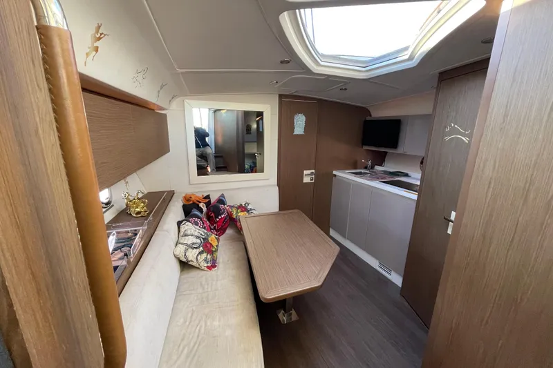  Yacht Photos Pics Interior of 2018 Benetau Gran Turismo 40 yacht, featuring modern design and cozy seating area.
