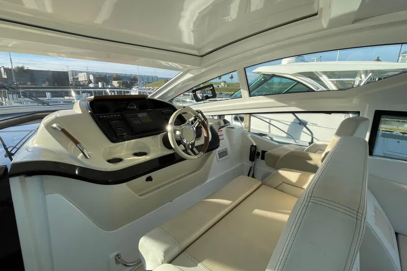  Yacht Photos Pics Interior of 2018 Benetau Gran Turismo 40 yacht, featuring modern helm and seating.