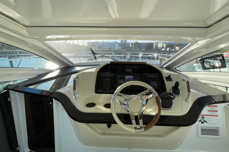  Yacht Photos Pics 2018 Benetau Gran Turismo 40 helm with modern controls and panoramic view.