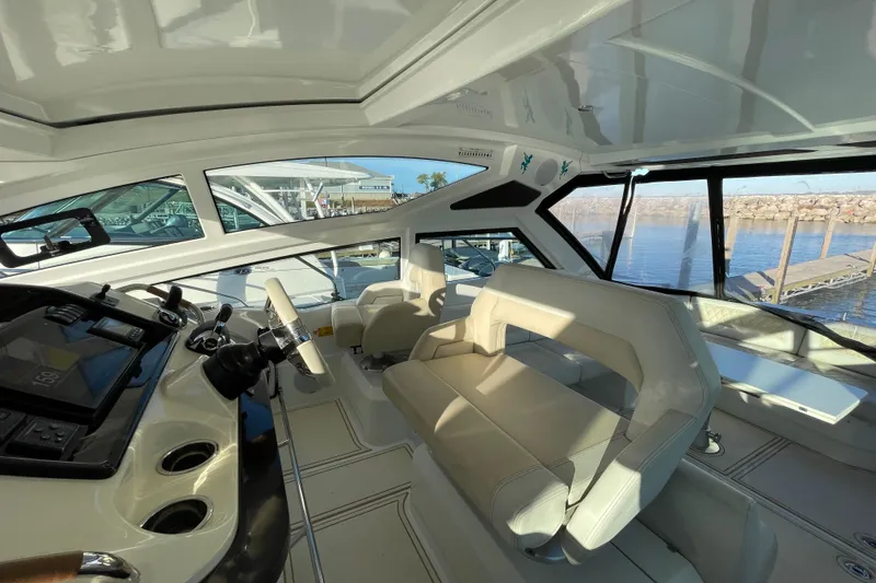  Yacht Photos Pics Interior of 2018 Benetau Gran Turismo 40 yacht with modern helm and seating.