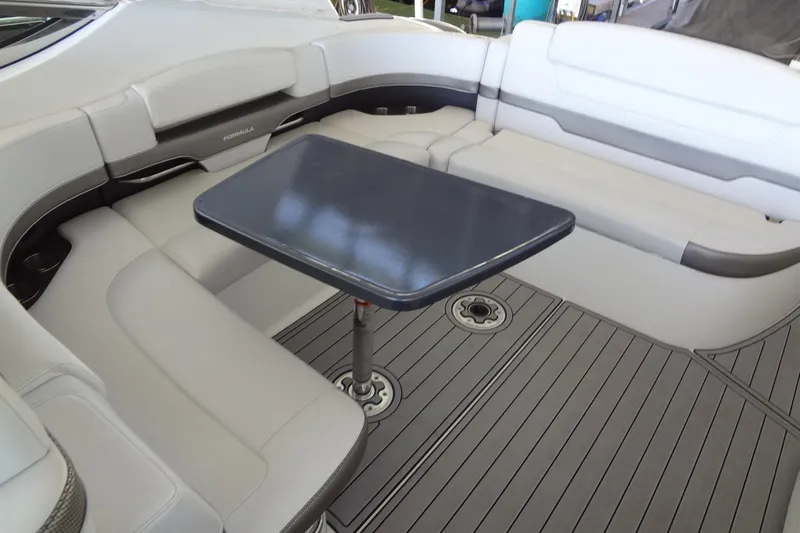 Double Double Yacht Photos Pics 2019 Formula 400 Super Sport boat interior with sleek seating and a central table.