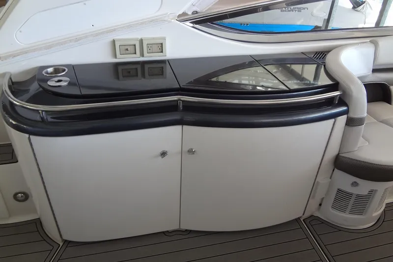 Double Double Yacht Photos Pics 2019 Formula 400 Super Sport yacht interior with sleek black countertop and storage cabinets.