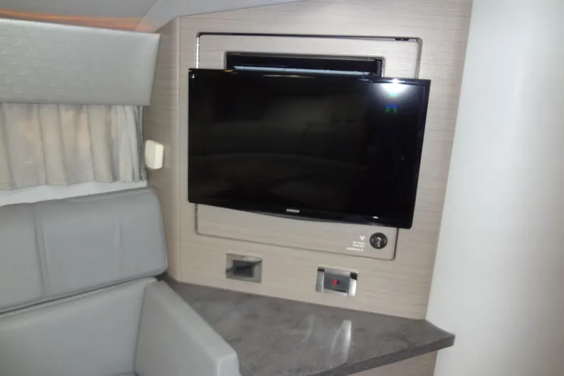 Double Double Yacht Photos Pics Interior of 2019 Formula 400 Super Sport with wall-mounted TV and seating area.