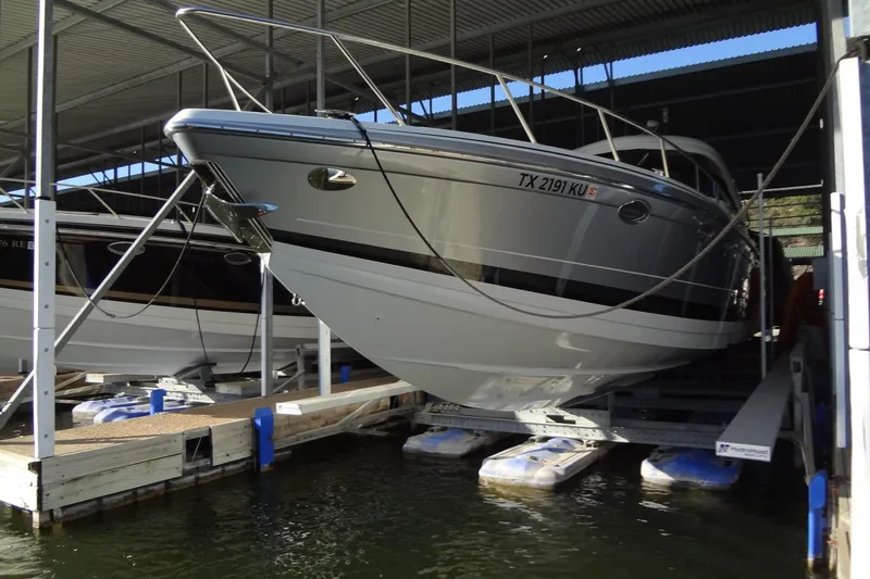 Double Double Yacht Photos Pics 2019 Formula 400 Super Sport boat docked in a covered marina.