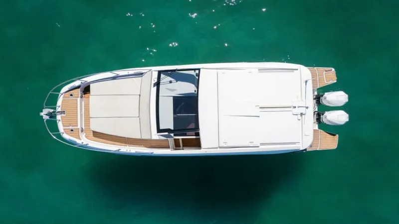 Debbie Yacht Photos Pics Aerial view of 2021 Beneteau Gran Turismo 32 yacht on turquoise water.
