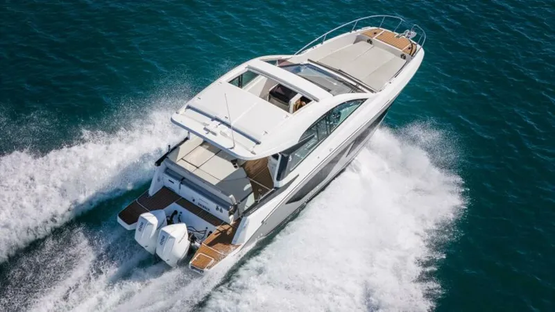 Debbie Yacht Photos Pics 2021 Beneteau Gran Turismo 32 cruising on open water, aerial view.