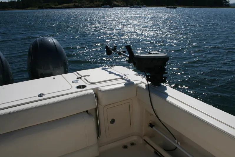 Monkey King Yacht Photos Pics Grady-White 232 Gulfstream 2021 boat on water, featuring dual engines and fishing equipment.