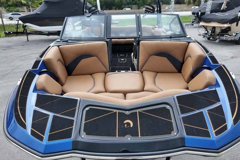 Yacht Photos Pics 2025 Centurion Fe23 boat with luxurious tan seating and sleek blue-black design.