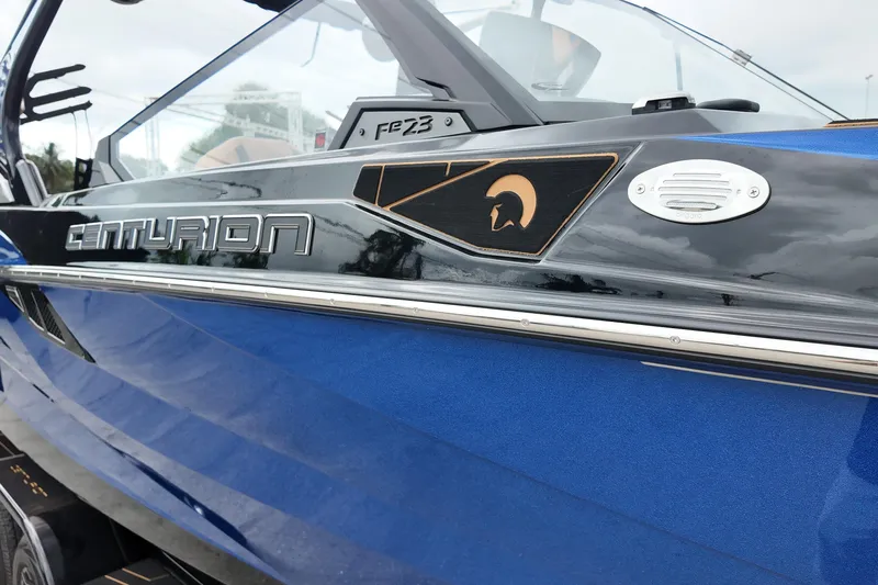  Yacht Photos Pics 2025 Centurion Fe23 boat, blue exterior with sleek design and logo detailing.