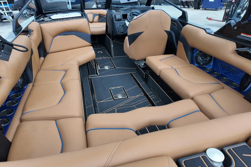  Yacht Photos Pics Luxurious interior of 2025 Centurion Fe23 boat with tan leather seating and modern design.